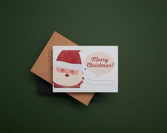 May include: A white Christmas card with a cartoon Santa Claus illustration. The card has a speech bubble that says "Merry Christmas!" and a blank space for a name.