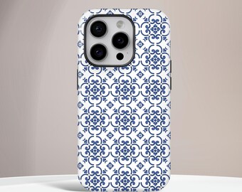May include: A white and blue patterned phone case. The case features a repeating floral design in a classic blue color. The phone case has a protective bumper around the edges and a camera cutout.