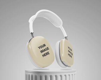 May include: Cream-colored over-ear headphones with a white headband and silver accents. The earcups have the text "YOUR IMAGE HERE". The headphones are displayed on a white cylindrical stand against a light gray background.