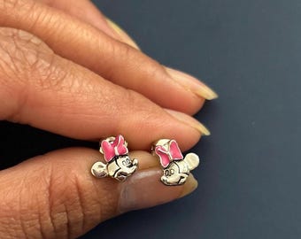 Brand new Disney Minnie Earrings Disney etched on the back of earrings.