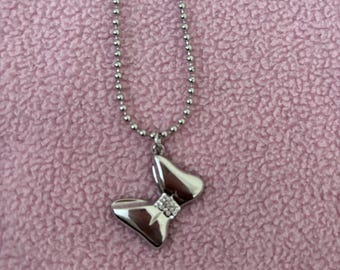 Official licensed Disney silver plated Minnie Mouse with embellished bow necklace, Lobster clasp closure, Disney etched tag, Without box