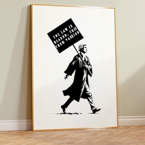 May include: Black and white illustration of a person in a judge's robe carrying a sign that reads "The law is reason, free from passion."