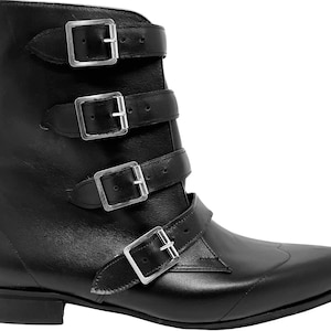 May include: Black leather ankle boots with a pointed toe and four silver buckles.