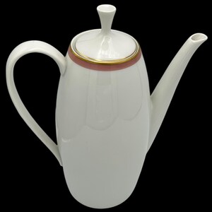 May include: White ceramic coffee pot with a pink and gold trim around the top. The pot has a rounded body and a spout on the right side. The lid has a small knob on top.