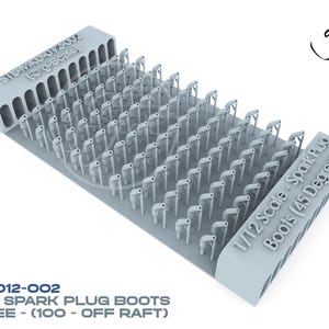 May include: A light gray 1/12 scale model of spark plug boots, 45-degree angle. The model is arranged in rows on a rectangular base. Text on the base reads "1/12 Scale - Spark Plug Boots (45 Degree)".