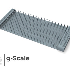 May include: A gray plastic 1/12 scale model making tool with a grid of small pegs for holding button heads and washers. The tool is labeled "1/12 Scale M10 Socket Button Heads & Washers".