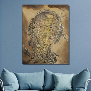 May include: Abstract art print featuring a swirling, textured design in shades of brown and gold. The design resembles a human face with closed eyes.