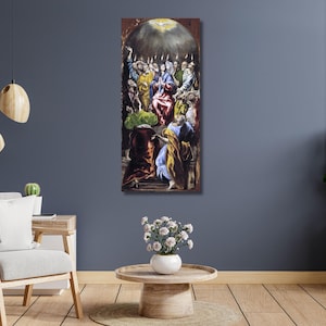 May include: A vertical framed painting depicting a religious scene with multiple figures in colorful robes. The artwork features a central figure surrounded by others, with a bright light emanating from above. The painting is displayed on a dark blue wall.