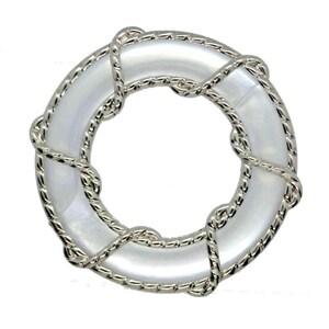 May include: A circular, silver-coloured metal ring with a white, pearlescent centre. The ring is wrapped with a twisted silver rope design. The overall aesthetic is nautical and elegant, suitable for jewellery or decorative purposes.
