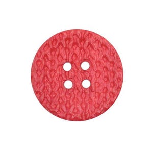 May include: A red button with a textured surface and four holes.