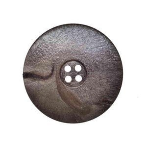 May include: A large, round, brown button with four holes in the centre. The button has a marbled pattern and a slightly textured surface.