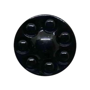 May include: A shiny black, circular item featuring a pattern of raised, rounded bumps around the edge. The surface is reflective, indicating a polished, hard material. The design is simple and symmetrical. The object is likely a decorative element.