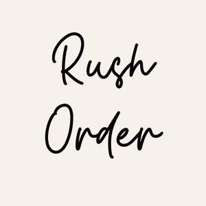 May include: Black and white handwritten text that reads "Rush Order".