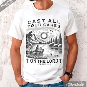 May include: White t-shirt featuring a black and white illustration of a fisherman in a boat on a lake, with mountains and trees in the background. The text "CAST ALL YOUR CARES ON THE LORD" is printed above the image, with "I PETER 5:7" below.