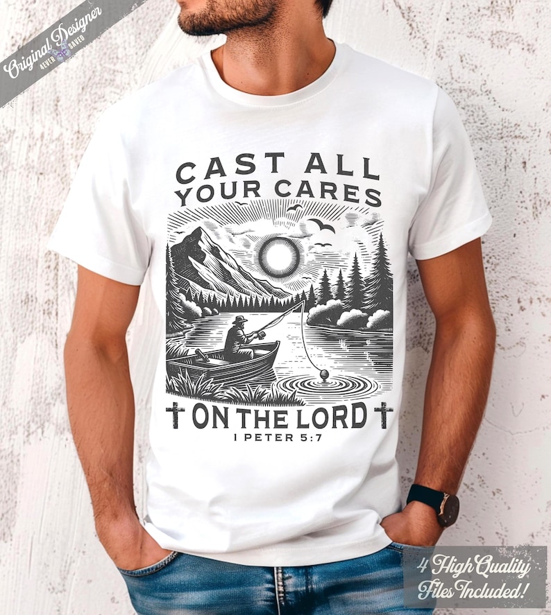 May include: White t-shirt featuring a black and white illustration of a fisherman in a boat on a lake, with mountains and trees in the background. The text "CAST ALL YOUR CARES ON THE LORD" is printed above the image, with "I PETER 5:7" below.