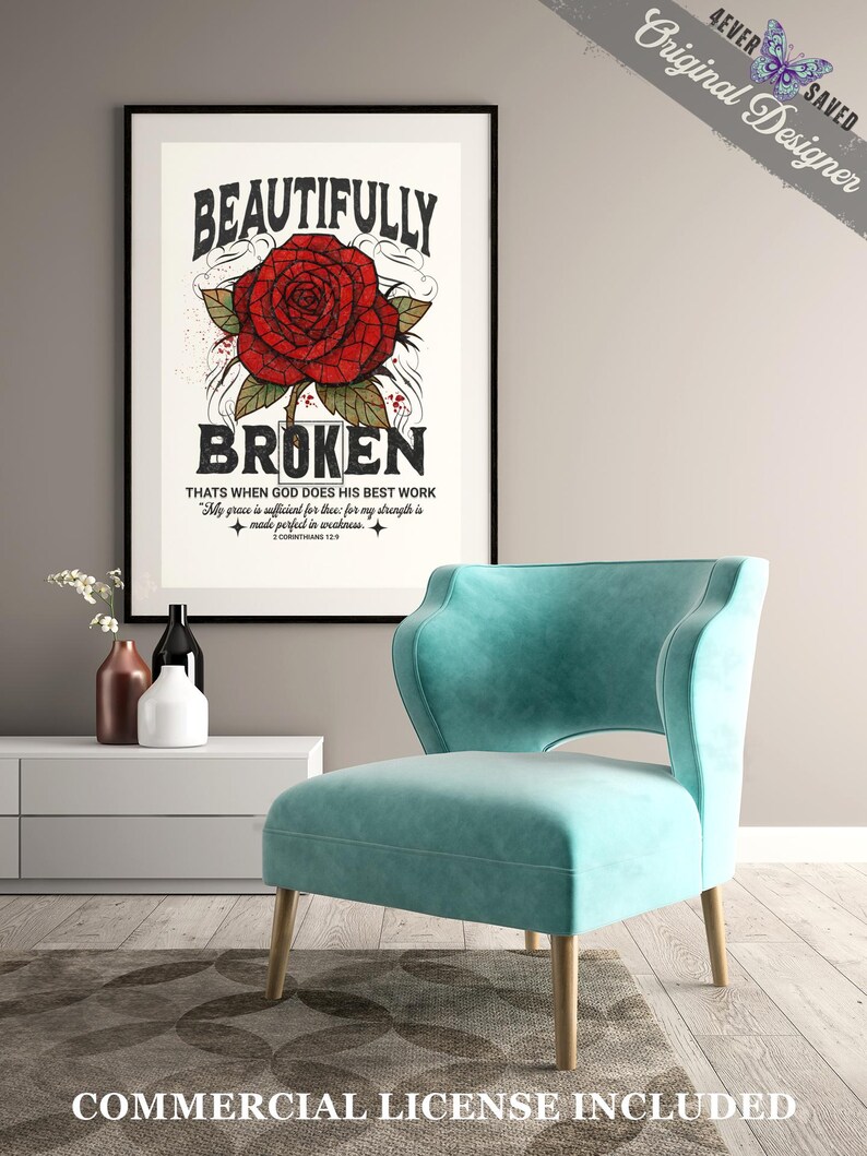 May include: A framed art print with the words "BEAUTIFULLY BROKEN" and a red rose illustration. Below the rose is the text "THATS WHEN GOD DOES HIS BEST WORK". A teal armchair with wooden legs sits in front of the print. The image also includes a white cabinet and decorative vases.