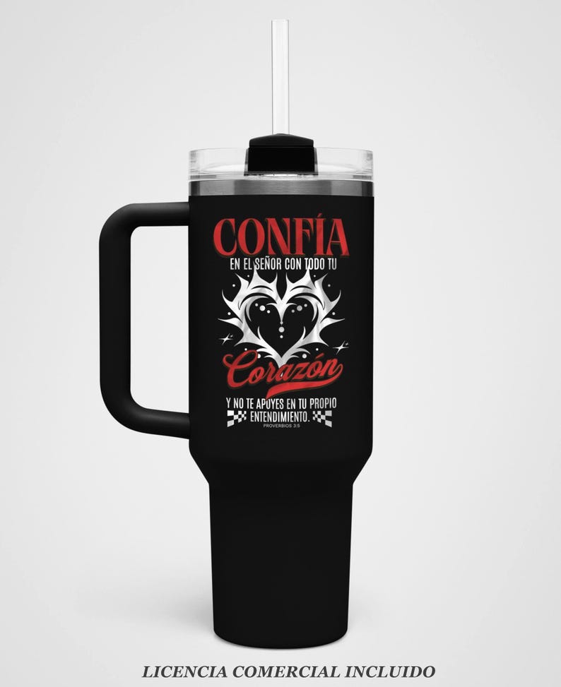 May include: Black insulated tumbler with a handle and a clear lid. The tumbler features the Spanish words "CONFIA" and "Corazon" in red script, along with other text and a heart design. Includes a straw.