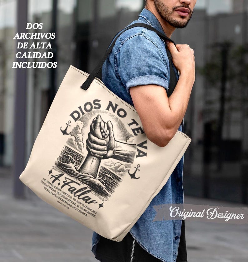 May include: Beige tote bag with black handles featuring a graphic of two hands clasped together, with the words "DIOS NO TE VA A FALLAR" and other text in Spanish. The bag also has two anchors and the text "DOS ARCHIVOS DE ALTA CALIDAD INCLUIDOS".
