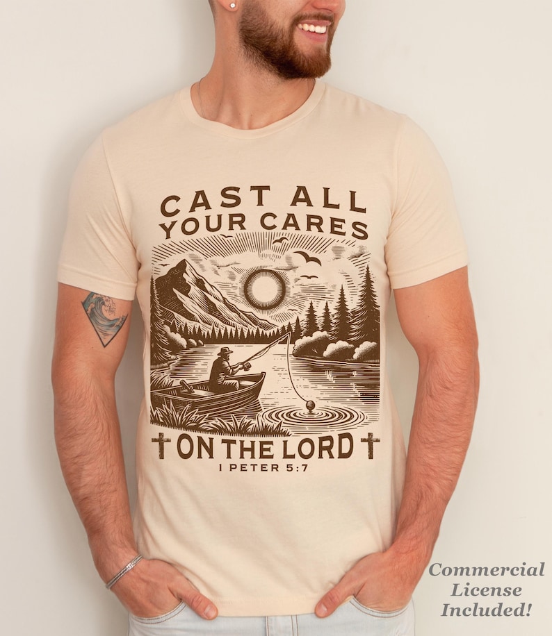 May include: Beige t-shirt with a brown graphic of a fisherman in a boat on a lake, mountains, and trees. Text reads "CAST ALL YOUR CARES ON THE LORD" with "I PETER 5:7" below. Includes a commercial license.
