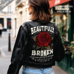 May include: Black denim jacket with a large red rose graphic and the words "BEAUTIFULLY BROKEN" on the back. The jacket also features text that reads "THAT'S WHEN GOD DOES HIS BEST WORK" and "My grace is sufficient for thee: for my strength is made perfect in weakness."