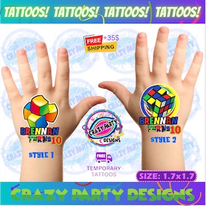 May include: Temporary tattoos with colorful designs. One tattoo features a Rubik's Cube, the other a block design. Both include the text "BRENNAN TURNS 10" and "STYLE 1" or "STYLE 2". The tattoos are 1.7 x 1.7 inches.
