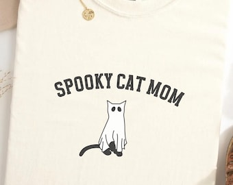 不気味な猫ママシャツ、黒猫ママシャツ、猫ママシャツ、ハロウィン猫シャツ、不気味な季節、猫好きへのギフト、かわいい猫シャツ、不気味な子猫