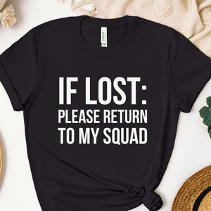 May include: Black t-shirt with white text that reads "IF LOST: PLEASE RETURN TO MY SQUAD".