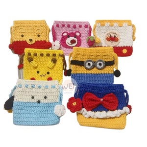 May include: A set of seven colorful crocheted drawstring bags featuring various cartoon characters, including Winnie the Pooh, a pink bear, a red-nosed character, a yellow character with ears, a minion, a blue and white character with a bow, and a yellow character with a flower.