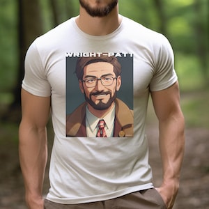May include: White t-shirt with a graphic print of a man with a beard and glasses. The text "WRIGHT-PATTI" is printed above the graphic.