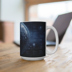 May include: White ceramic mug with a black and blue design featuring a detailed illustration of the Death Star from Star Wars. The mug has a handle on the right side.