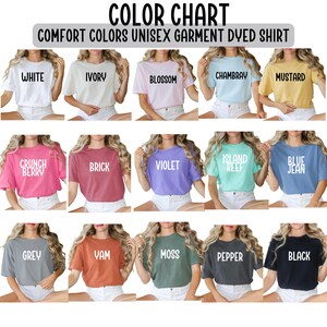 May include: Color chart of Comfort Colors unisex garment dyed shirts. The chart displays various shirt colors, including white, ivory, blossom, chambray, mustard, crunch berry, brick, violet, island reef, blue jean, grey, yam, moss, pepper, and black.