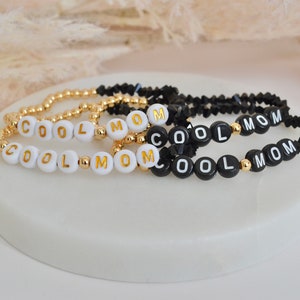 Custom personalized letter bracelet, stretchy black and gold image 2
