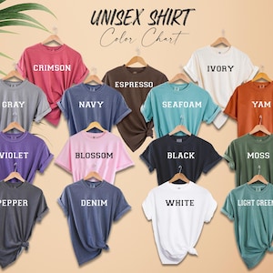 a bunch of different colored shirts on a hanger
