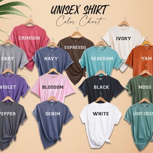 a bunch of different colored shirts on a hanger