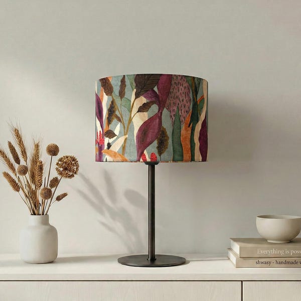 Lampshade “Makakilo” with tropical leaf pattern in warm autumn tones