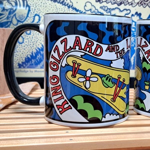Flying Gators Panel Design -  Black Handle Two-Tone King Gizzard and the Lizard Wizard Coffee Mug