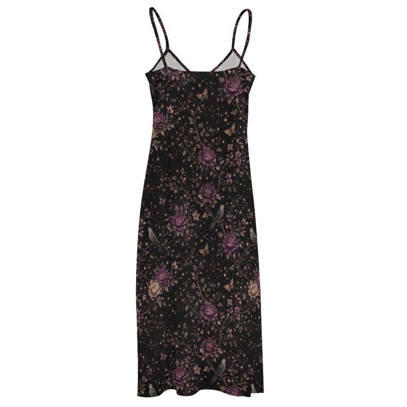 May include: A black slip dress with a floral design of purple roses, birds, and butterflies. The dress has thin straps and a V-neck. The fabric is decorated with small, gold-coloured dots.