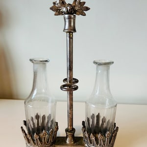 Vintage silver plated cruet set with glass bottles