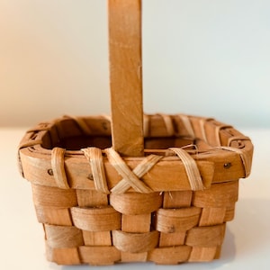 Tiny, vintage, 1970’s handmade woven basket with handle.