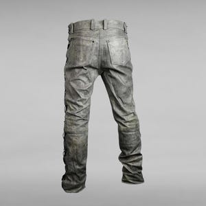 May include: Gray denim jeans with a distressed look and black lacing down the sides of the legs.