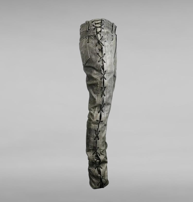 May include: Gray denim pants with black laces running up the side seams.