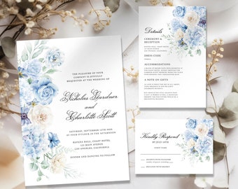May include: Wedding invitation suite featuring floral watercolor designs in shades of blue and white. The invitation includes the names Nicholas Gardner and Charlotte Scott, along with event details. The suite includes an invitation, details card, and RSVP card.