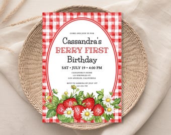 May include: A birthday invitation with a red and white checkered background. The invitation reads "Cassandra's BERRY FIRST Birthday" with the date and time. The bottom features a watercolor illustration of strawberries and daisies.