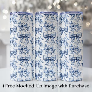 May include: Three stainless steel tumblers with a white and blue floral and bow pattern. The design features blue bows and floral arrangements on a white background. The tumblers have a blue lid.