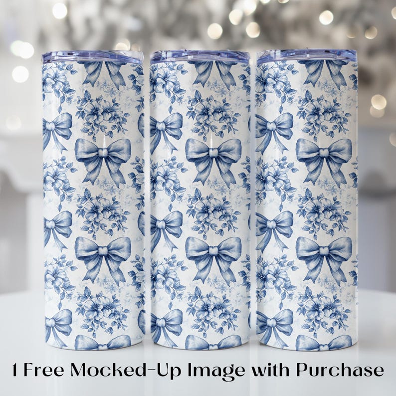 May include: Three stainless steel tumblers with a white and blue floral and bow pattern. The design features blue bows and floral arrangements on a white background. The tumblers have a blue lid.