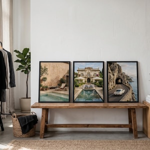 May include: Three rectangular wall art prints in black frames displayed side-by-side. The left print shows a pool by a tan wall, the center print features a villa with a pool, and the right print depicts a white car driving on a coastal road.