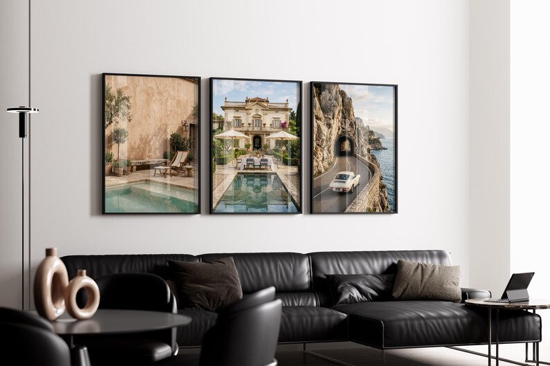 May include: A set of three framed wall art prints displayed in a row. The left print shows a pool by a beige wall, the center print features a grand villa with a pool, and the right print depicts a vintage car driving on a coastal road by cliffs.