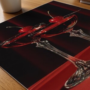 Peut inclure: Deux verres &agrave; cocktail &agrave; pied remplis d'un liquide rouge, chacun garni d'une cerise. Les verres sont pos&eacute;s sur un fond rouge fonc&eacute; et noir. L'image est un gros plan, mettant en valeur la verrerie &eacute;l&eacute;gante et les cerises rouges vibrantes.