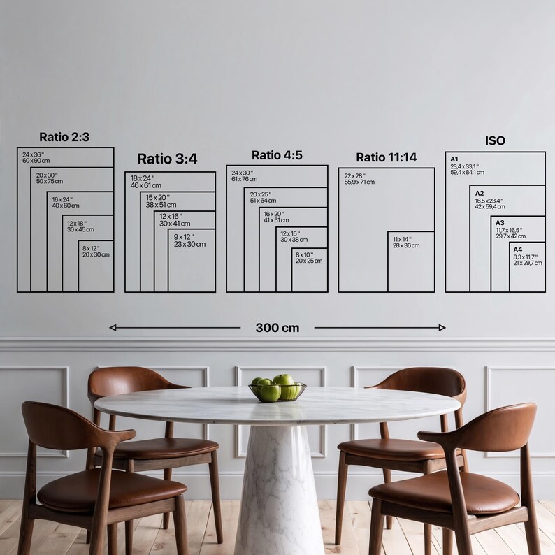 May include: A wall display featuring various rectangular frame sizes and aspect ratios, including 2:3, 3:4, 4:5, 11:14, and ISO standards. The image also shows a table with a marble top and four brown chairs.
