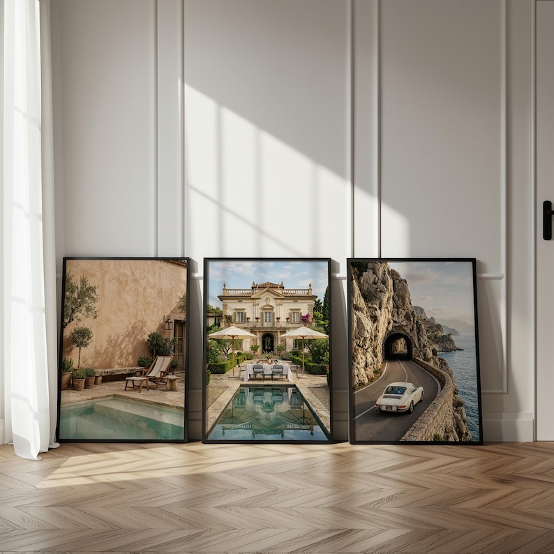 May include: Three framed wall art prints displayed side-by-side. The left print shows a pool with lounge chairs. The center print features a villa with a pool and dining area. The right print depicts a white car driving on a coastal road by a tunnel.